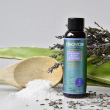 Aleavia Body Cleanse bottle displayed near a spoonful of salt and some lavender