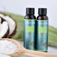 Aleavia Enzymatic Body Cleanse bottles displayed next to a spoonful of sea salt